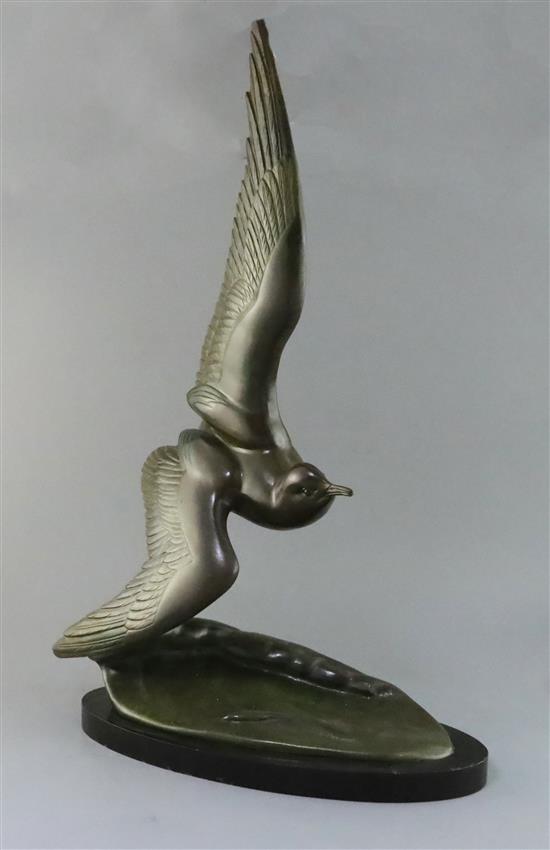 Irene Rochard. An Art Deco bronze model of a seagull flying over a wave, height 27.5in.